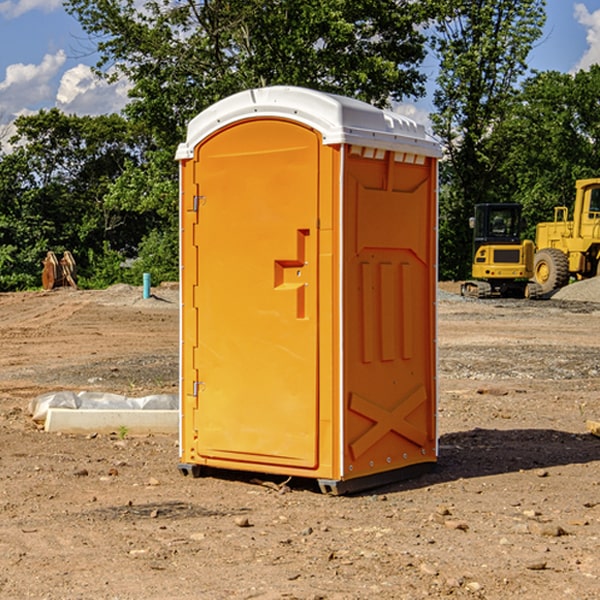 what is the cost difference between standard and deluxe portable toilet rentals in Guys Mills